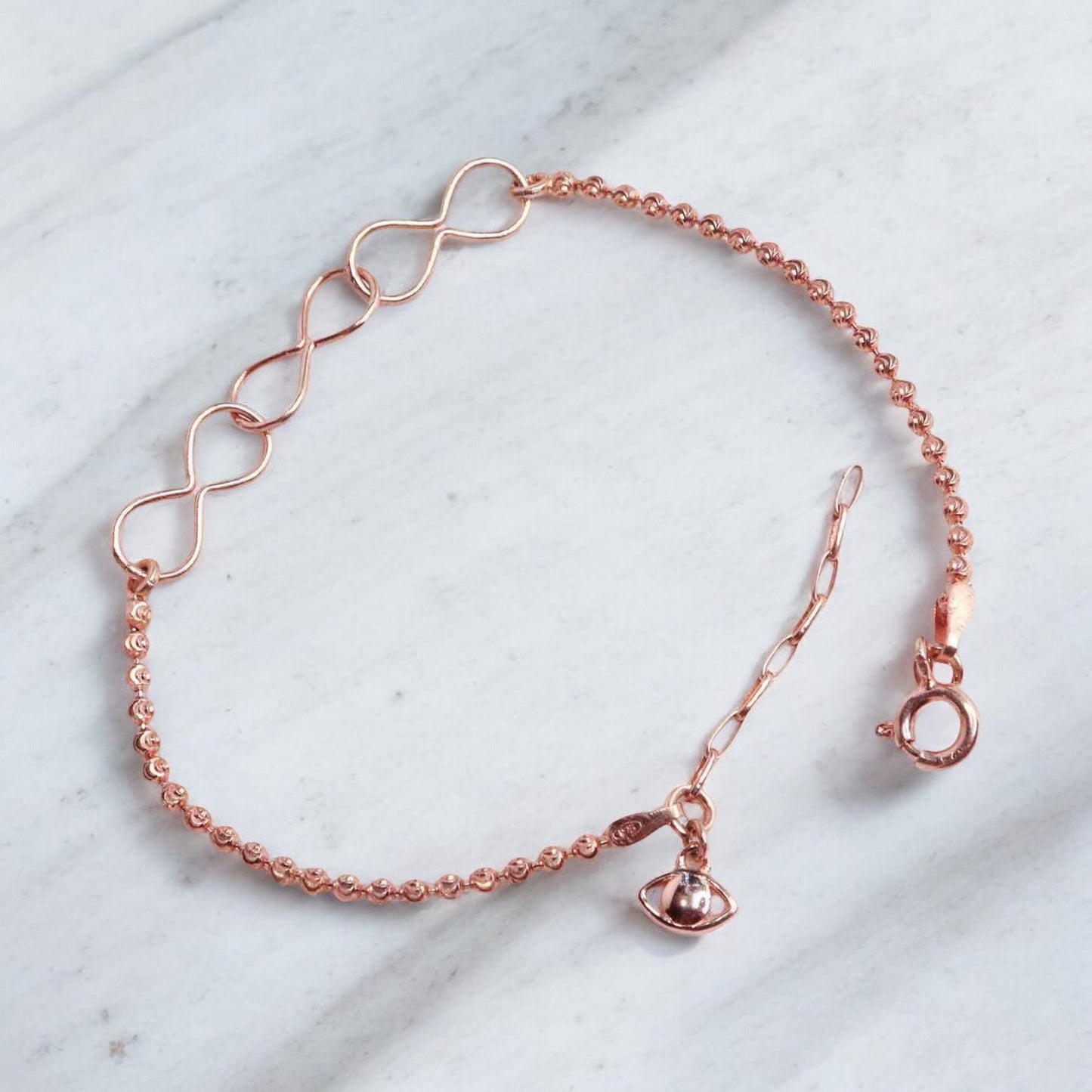 Elegant silver bracelet with a rose gold finish for women, featuring a sleek and sophisticated design, perfect for adding a touch of warmth and luxury to any outfit.