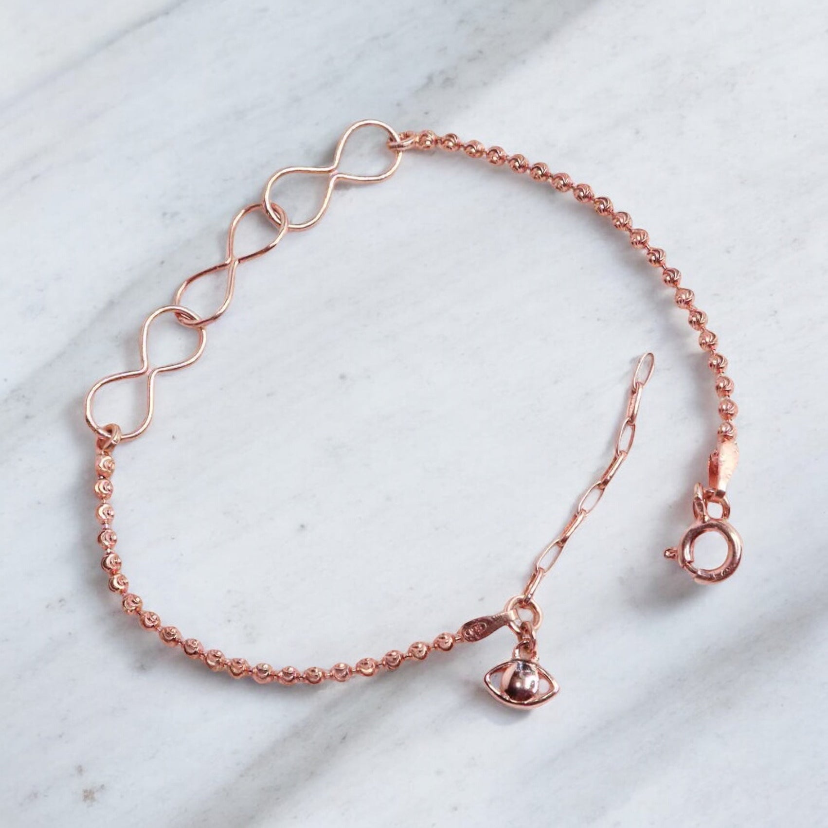 Elegant silver bracelet with a rose gold finish for women, featuring a sleek and sophisticated design, perfect for adding a touch of warmth and luxury to any outfit.