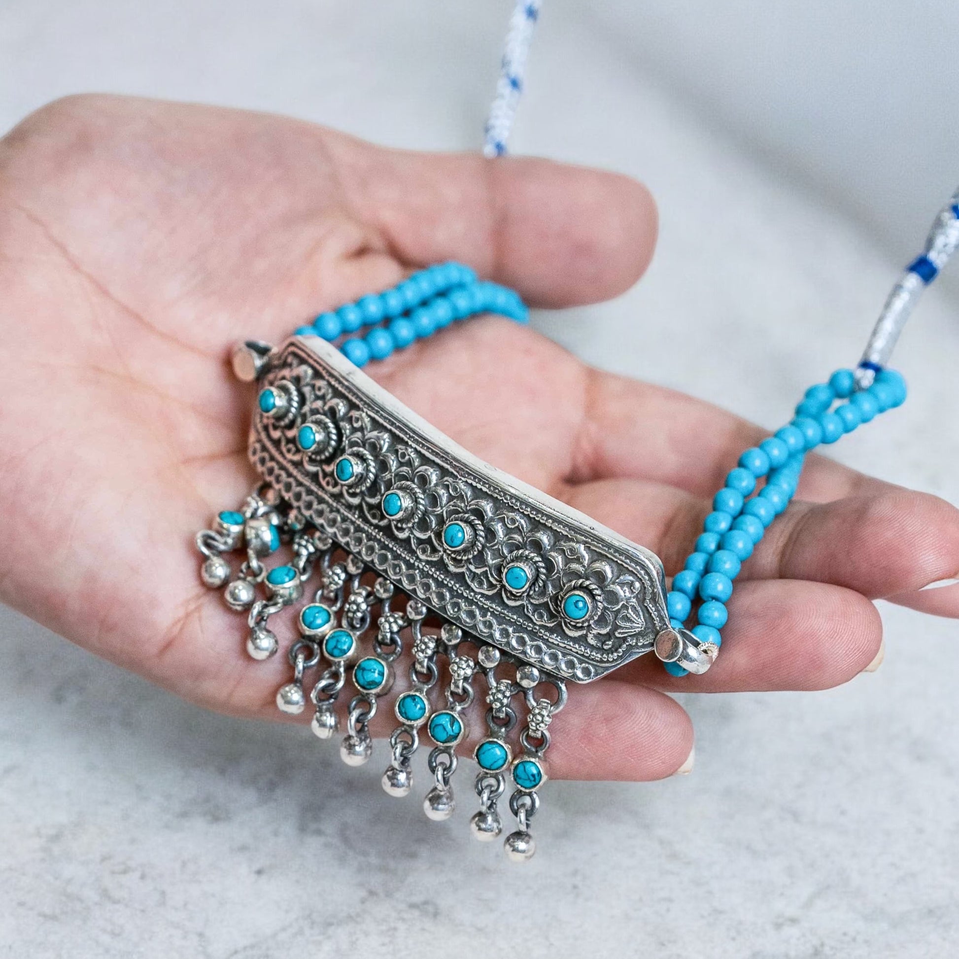 Beautiful silver choker with intricate patterns and a vintage finish, offering a bold, antique look for statement styling.
