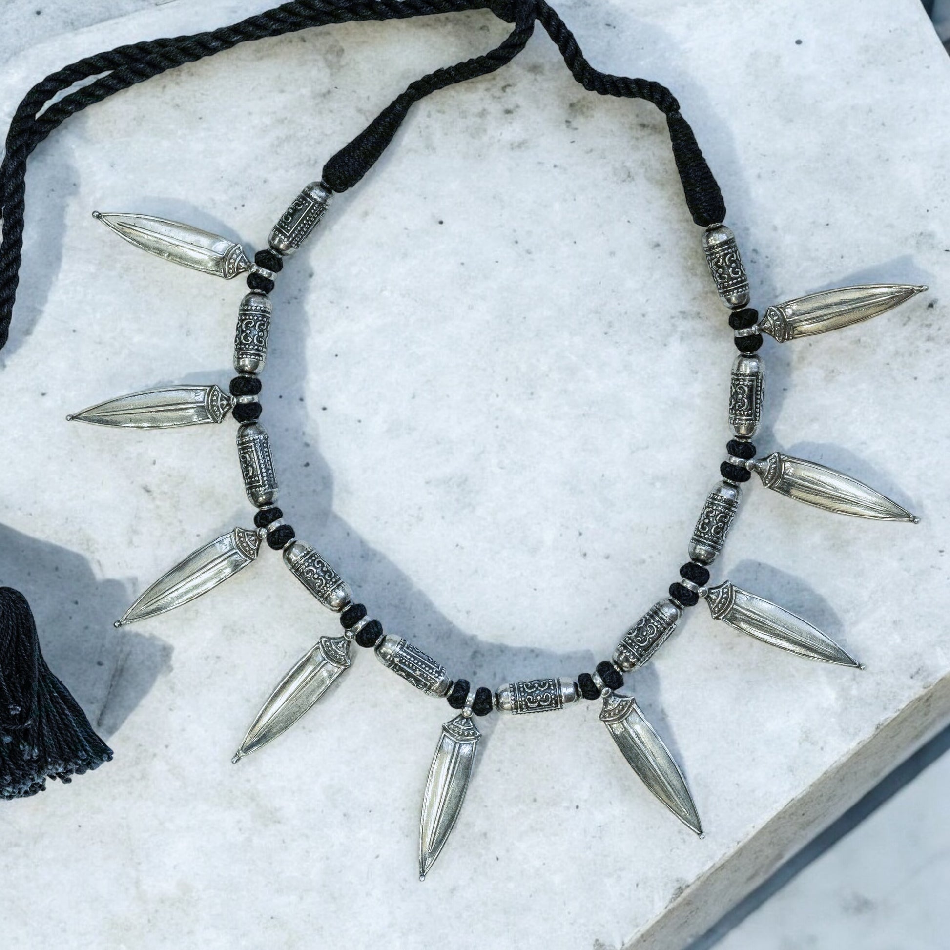 Striking oxidized silver necklace with detailed vintage-inspired patterns, offering a bold, unique look with a timeless, antique finish.