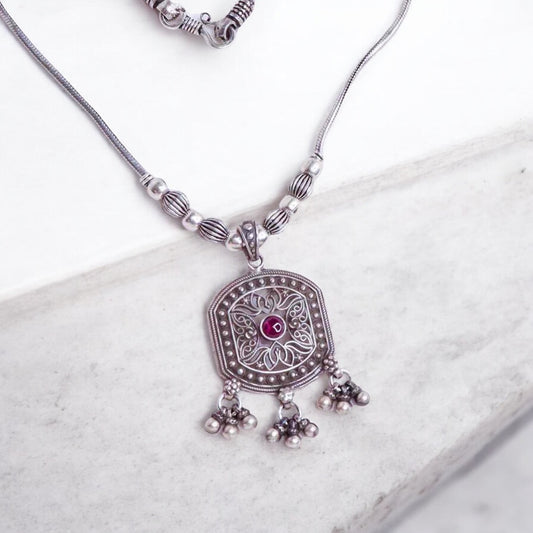 Striking oxidized silver necklace with detailed vintage-inspired patterns, offering a bold, unique look with a timeless, antique finish.
