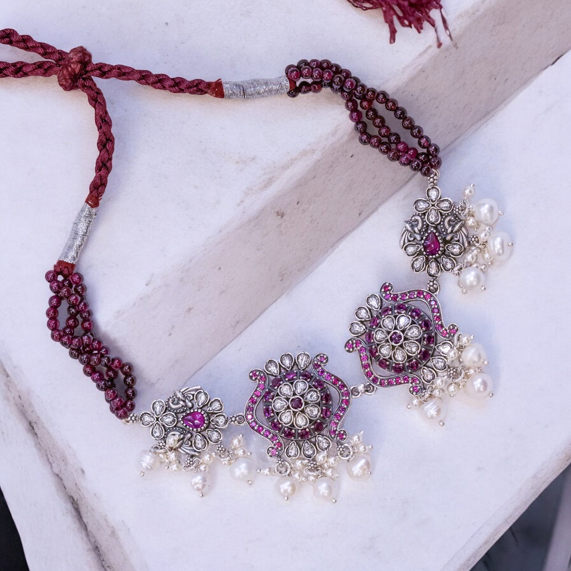 Beautiful oxidized silver choker with intricate patterns and a vintage finish, offering a bold, antique look for statement styling.

